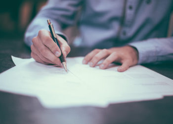 a-man-writing--three-lessons-from-phd-diploma