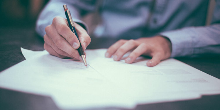 a-man-writing--three-lessons-from-phd-diploma