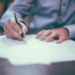 a-man-writing--three-lessons-from-phd-diploma