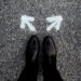 leather-shoes-on-asphalt-road