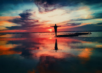 a-man-standing-in-the-sunset-lianchiyu-blog-the-top-of-your-profession