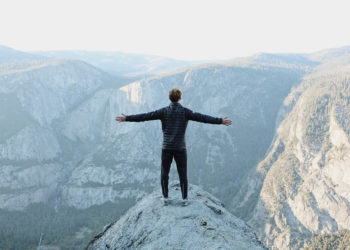 a-man-standing-on-the-peak