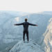 a-man-standing-on-the-peak