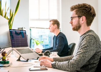 two-men-working-hard